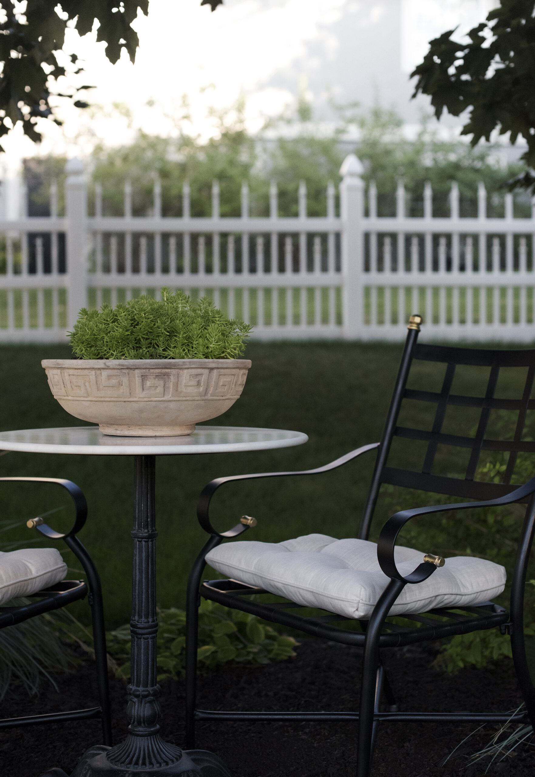 Greek Key Terracotta Planter on Bistro table with Iron Chairs